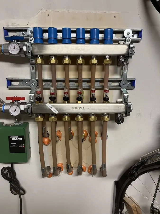 Plumber performing Water Heater Repair at a residential property in Elsmere